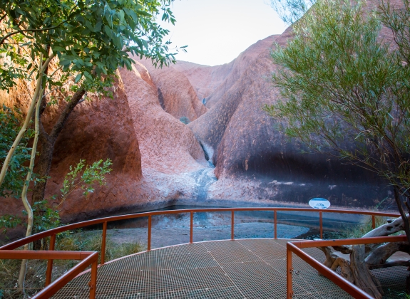 Mutitjulu Waterhole on the Kuniya walk at Uluru on a clear winter's afternoon in the Northern Territory, Australia