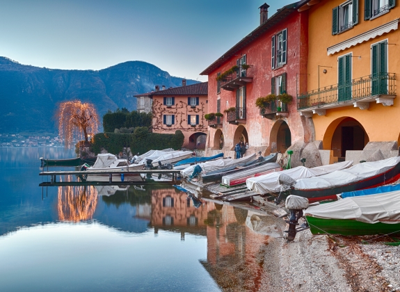boats on calm waters of lake como, italy