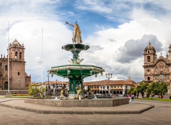 Panoramic view of Plaza de Armas with Inca fountain, Cathedral and Compania de Jesus Church - Cusco, Peru