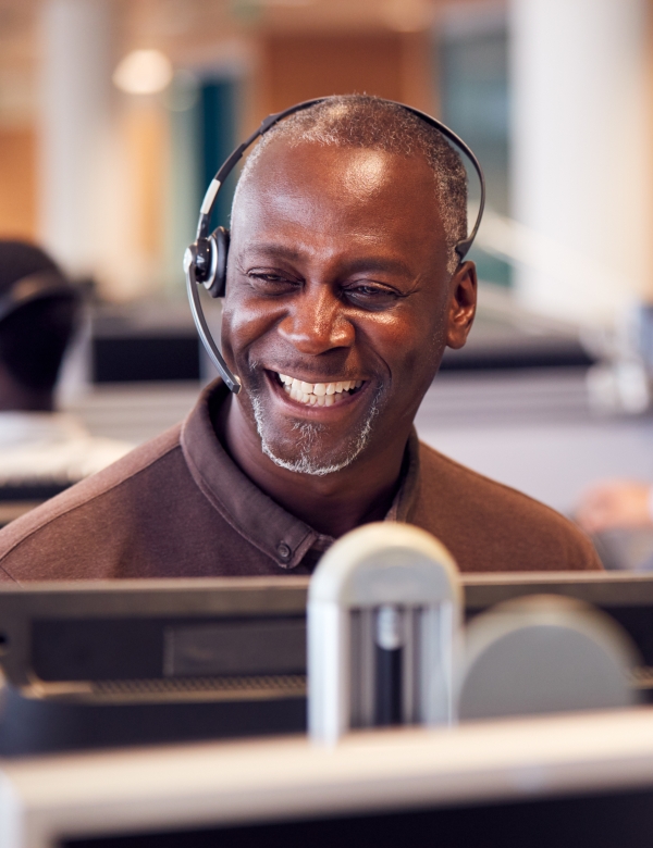 Rail expert Wearing Telephone Headset Talking To Caller