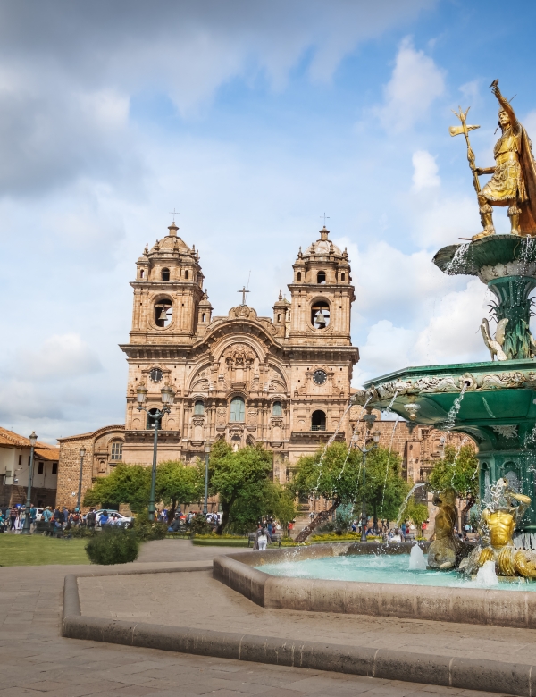Panoramic view of Plaza de Armas with Inca fountain, Cathedral and Compania de Jesus Church - Cusco, Peru