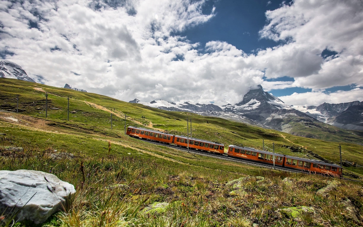 The Gornergrat A train travels uphill through the Swiss Alps