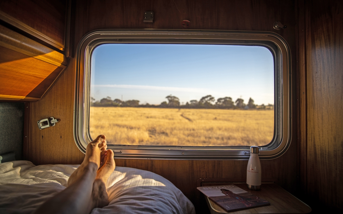Person laying down in the Gold Class Single accommodation