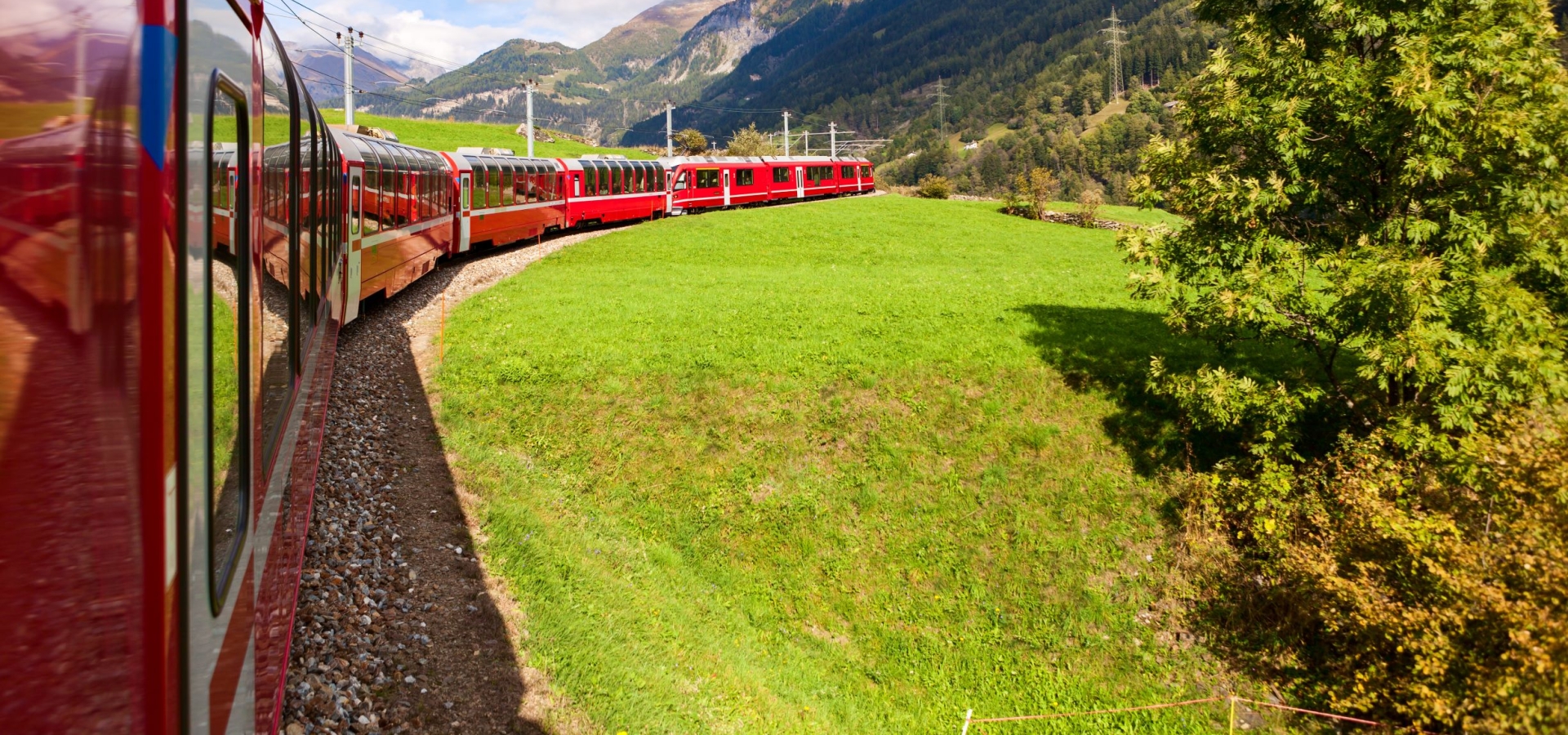 The Bernina Express A train travels round a curved track in summer