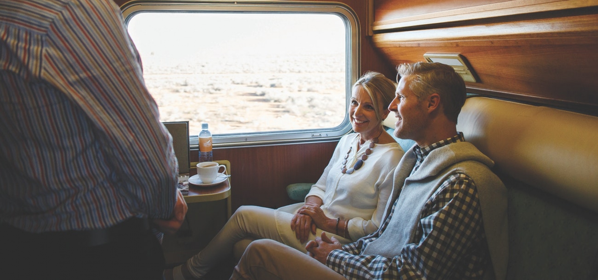 A couple sat in a twin cabin onboard the train