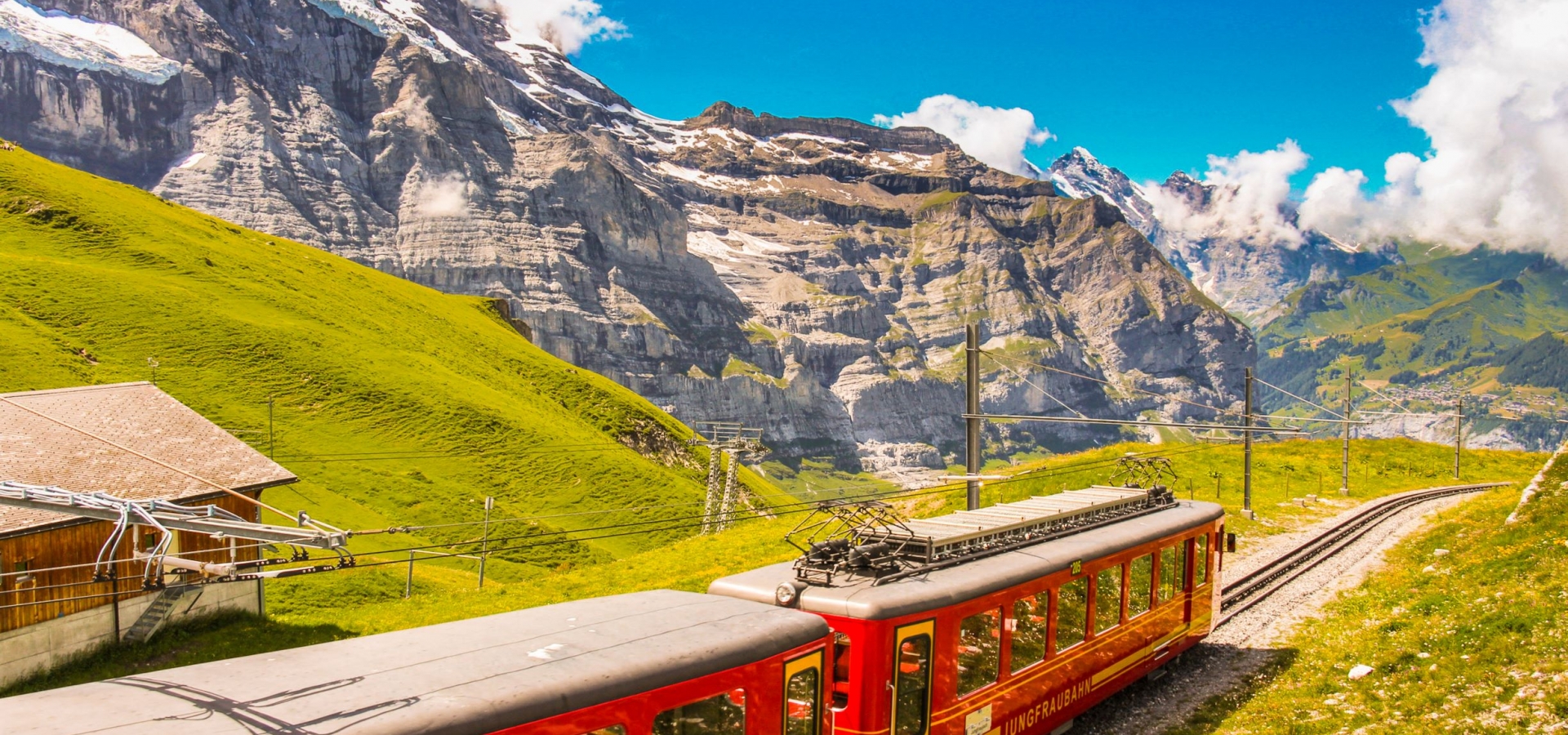 The Jungfrau Railway A train travels through Alpine landscape up a mountain