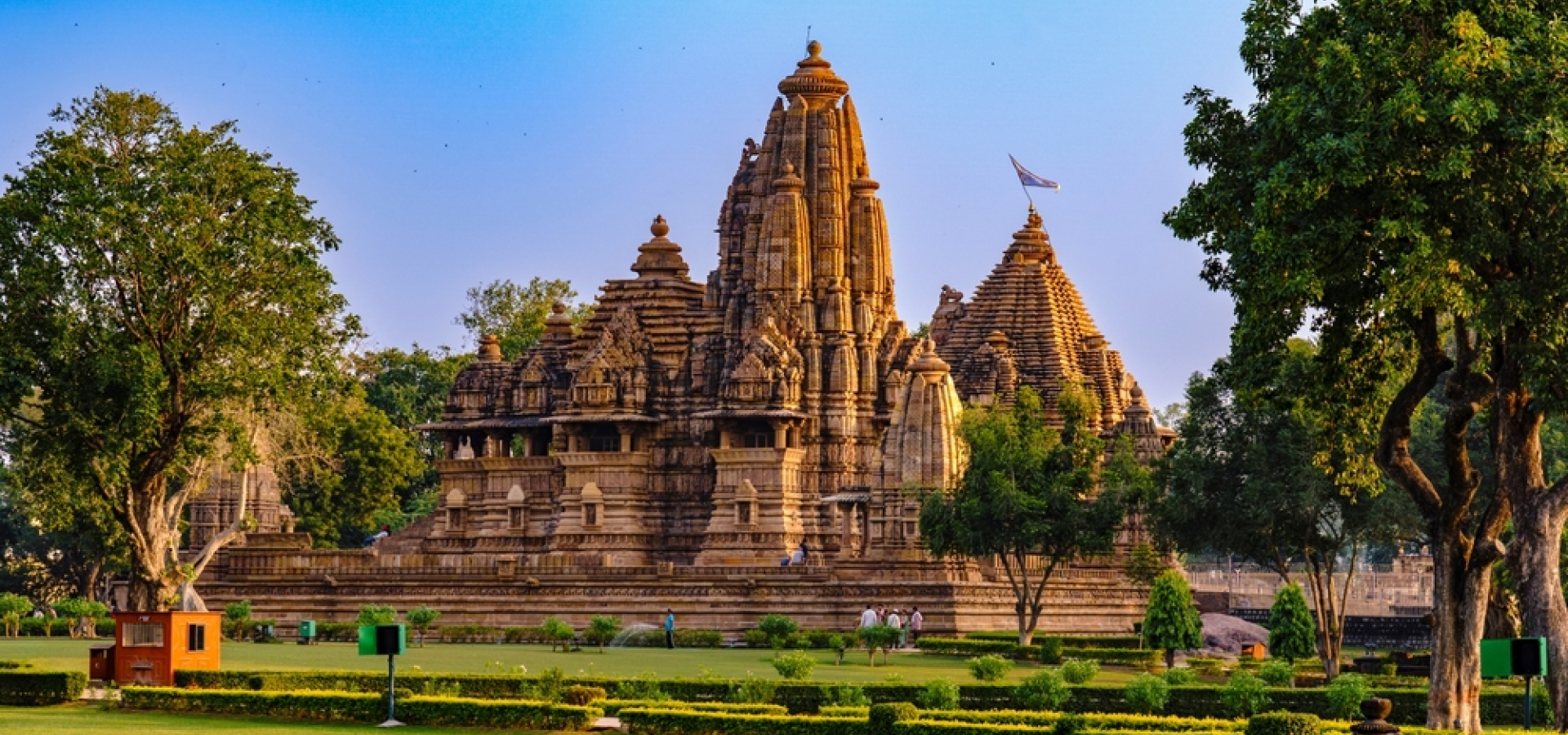 India. Madhya Pradesh state. The Khajuraho Group of Monuments are a group of Hindu and Jain temples. Vishvanath or Visvanatha temple under a blue sky