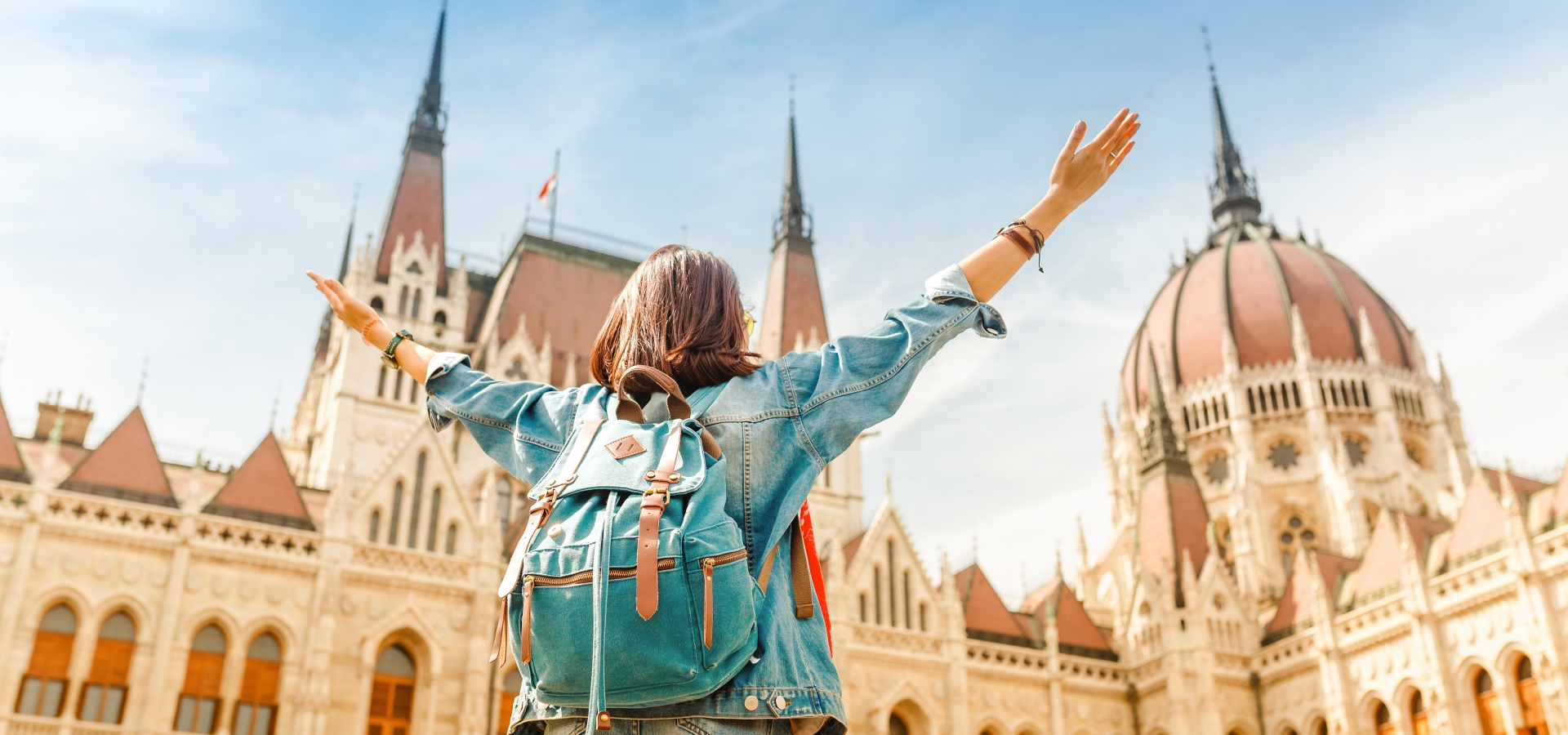 woman enjoying great view of the Parliament building in Budapest city