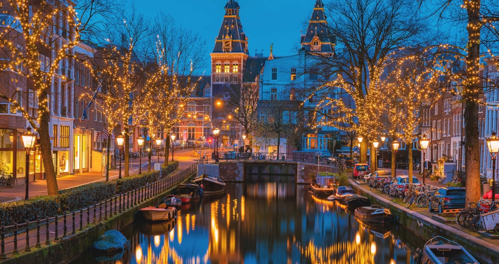 Amsterdam Netherlands canals with Christmas lights during December, canal historical center of Amsterdam at night. Europe