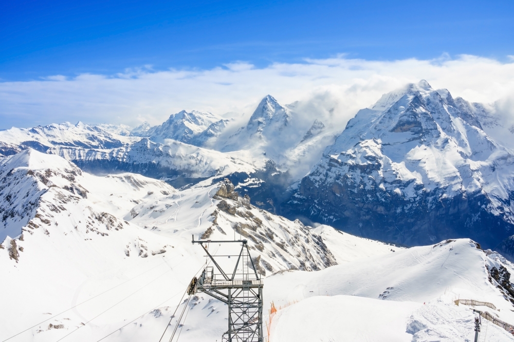 Stunning panoramic view of the Swiss Alps from the top of the Schilthorn mountain in the Jungfrau region of the country