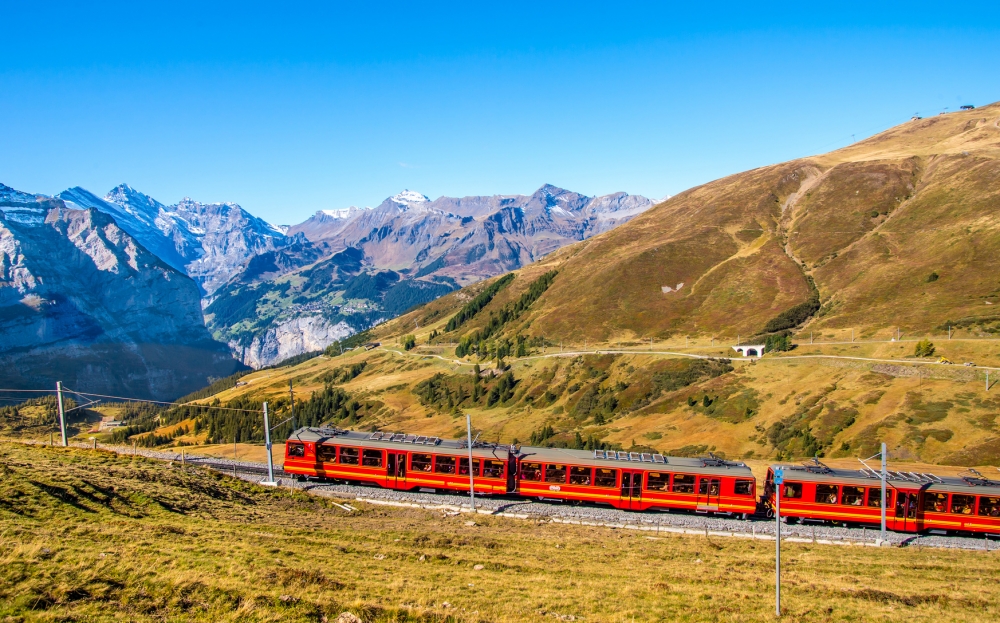 Swiss red train is cimbing to Jungfraujoch the top rail station in Europe.